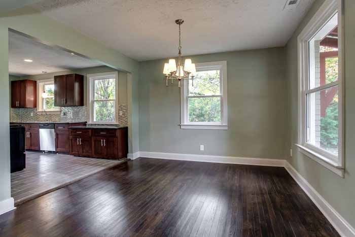 Dining area opening into a warm wood kitchen
